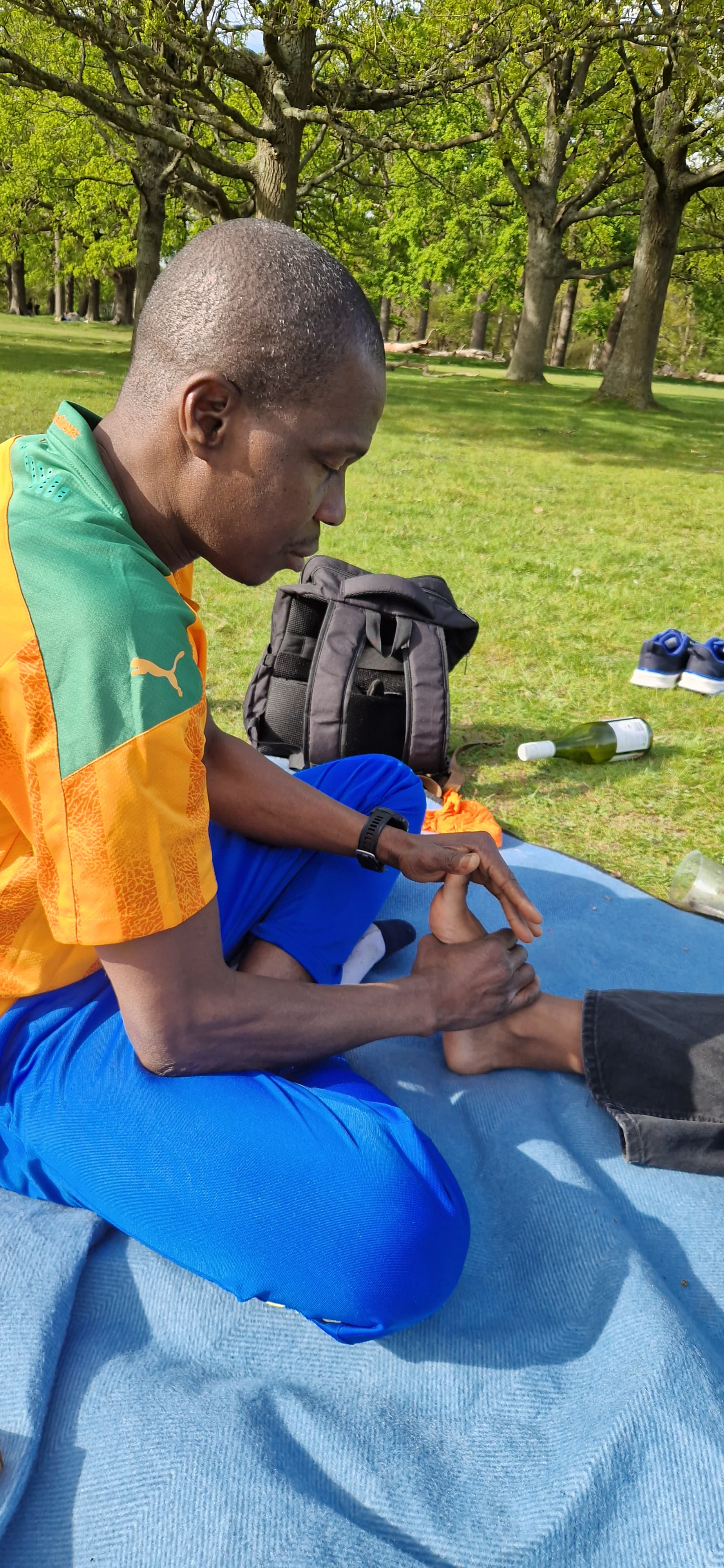 Close view of an outdoor reflexology session